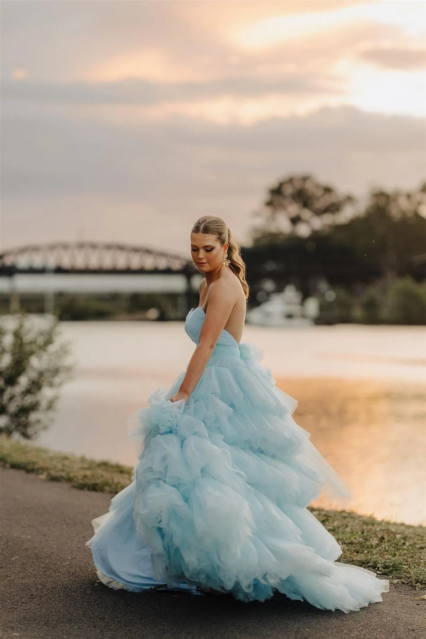 V-neck strapless dress with 5 tiered voluminous tulle skirt with open V back