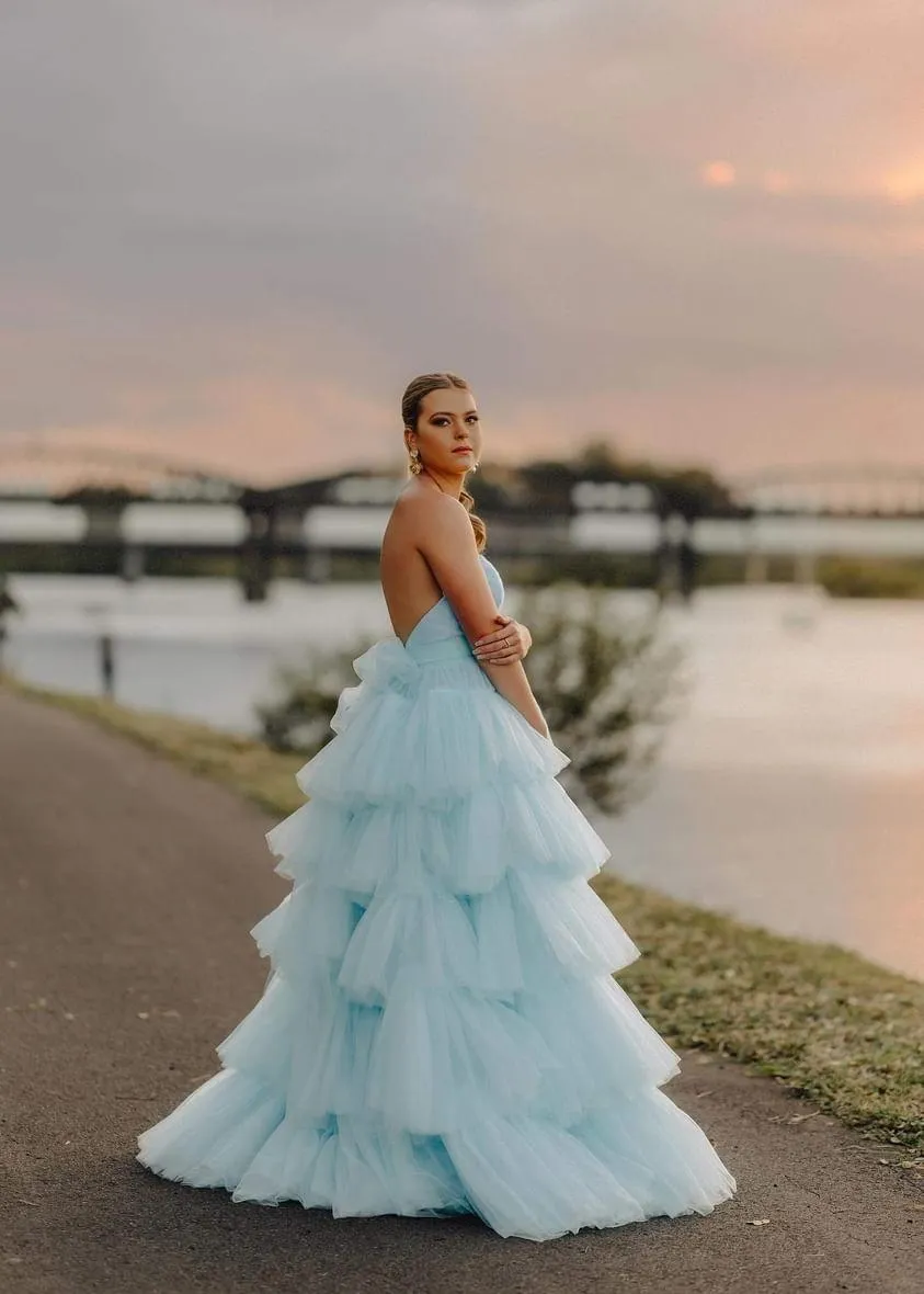 V-neck strapless dress with 5 tiered voluminous tulle skirt with open V back